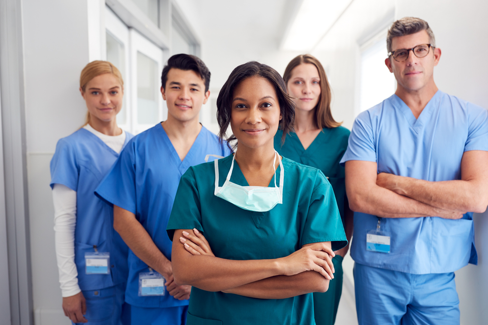 Medical Team Standing In Hospital Corridor