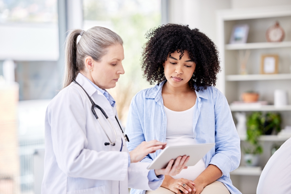 Pregnant Woman Doctor And Tablet