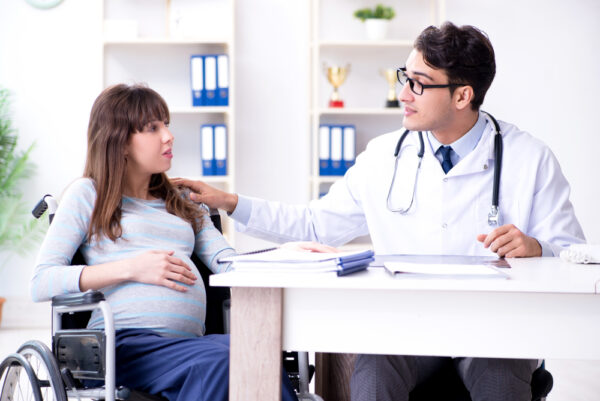 Pregnant Woman Visiting Doctor For Consultation