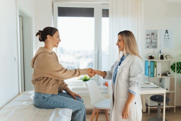 Teenage Patient Arriving At Appointment With Doctor