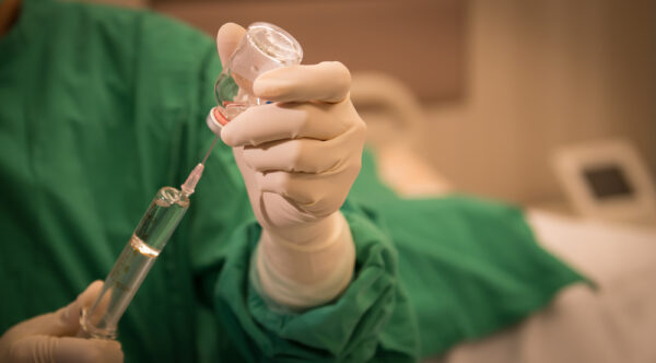 Doctor Holding Syringe Prepares For Injection epidural