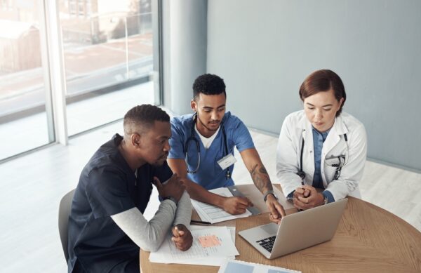 Nurses In Meeting With Laptop