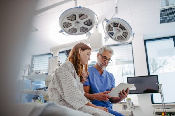 Doctor Discussing Test Results With Teenage Patient
